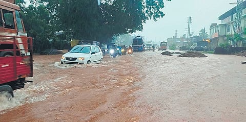 Vehicles plough through NH-66 in Bhatkal after heavy rainfall on Wednesday.