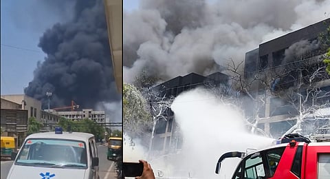 Smoke billows near the site of an Air India flight crash near Ahmedabad airport on Thursday.