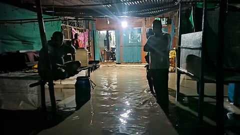 Residents in a flooded house spend sleepless night 