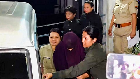 Police escort Sonam Raghuvanshi, accused in the alleged murder of her husband Raja Raghuvanshi during their honeymoon in Meghalaya, after her medical check-up at Ganesh Das Hospital, in Shillong, Wednesday, June 11, 2025. 