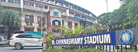 Fans cheering as the bus carrying Royal Challengers Bengaluru cricketers, winners of the Indian Premier League, arrive at the M. Chinnaswamy Stadium.