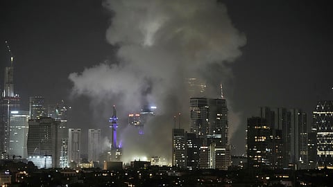 Smoke rises after a missile attack in Tel Aviv, Israel, Friday, June 13, 2025.