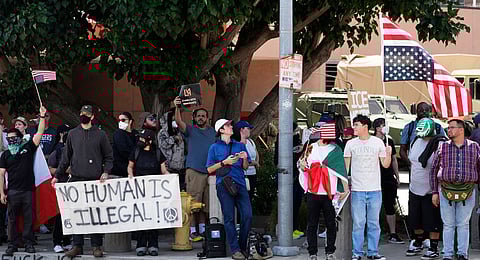 Protesters against federal immigration raids gather outside the Metropolitan Detention Center, Wednesday, June 11, 2025, in Los Angeles.