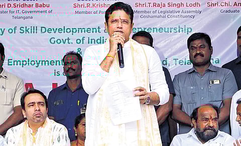 IT Minister Sridhar Babu speaks after inaugurating a job and loan mela while Union minister Jayant Chaudhary (left) looks on in Hyderabad on Monday.