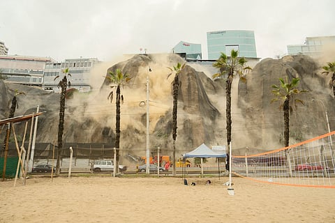 Dust billows out of a landslide during an earthquake in Lima on June 15, 2025. A magnitude 6.1 earthquake that shook Lima and its surrounding areas caused one death in Peru's capital and several landslides.