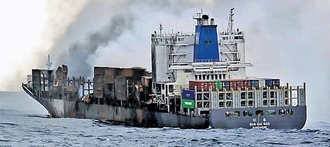 Smoke billowing out of the deck of MV Wan Hai 