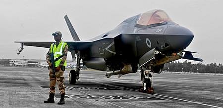 A CISF official guarding the UK F-35 B stealth fighter, grounded at Thiruvananthapuram airport