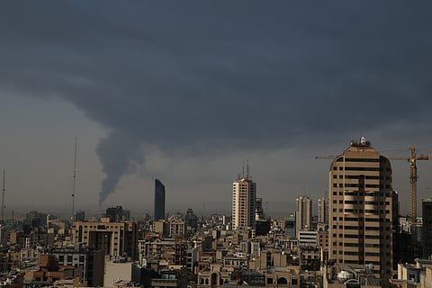 Huge smoke rises up from an oil facility facility after it appeared to have been hit by an Israeli strike Saturday, in southern Tehran, Iran, Sunday, June 15, 2025.