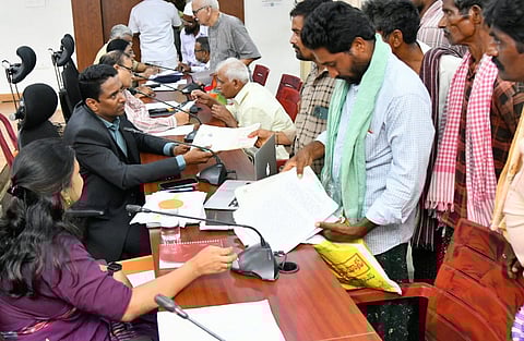 NTR district collector G Lakshmisha takes representations from the public during PGRS in Vijayawada on Monday. 