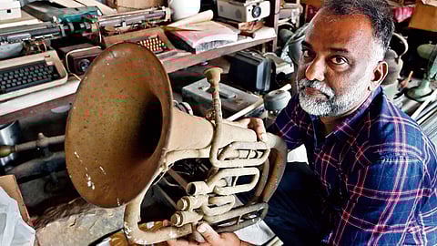 Abey with a trumpet he inherited from his grandfather’s collection