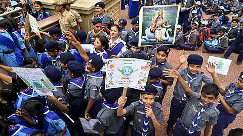 Students participate in ‘Our Walk Towards Environment’, a rally as part of World Environment Day celebrations, from Vidhana Soudha in Bengaluru on Tuesday.