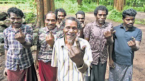 Cholanaikkan tribe member Chadayan, along with his sons and grandsons, after casting votes at the Nedumkayam tribal booth