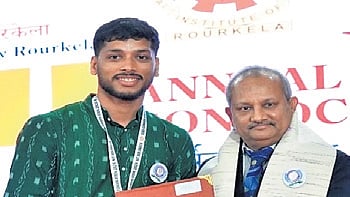 A student receiving his degree at the convocation ceremony on Friday.