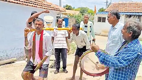 In a bid to appease rain God, villagers play ‘Kappatalli’ at Peddapapaiahpalli in Huzurabad mandal of Karimnagar district on Friday.
