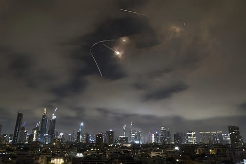 Israeli air defense system fires to intercept missiles during an Iranian attack over Tel Aviv, Israel, Saturday, June 21, 2025.