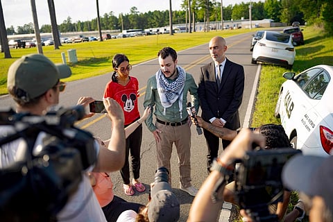 Palestinian activist Mahmoud Khalil, center, speaks after his release from federal immigration detention in Jena, La., Friday, June 20, 2025.