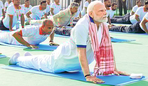 Prime Minister Narendra Modi, Chief Minister N Chandrababu Naidu and others perform yoga on the occasion of the International Yoga Day at RK Beach in Visakhapatnam on Saturday.