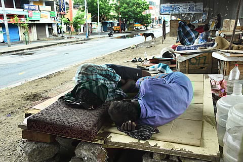 Homeless people take a nap on the lockdown day under the velachery flyover in Chennai.