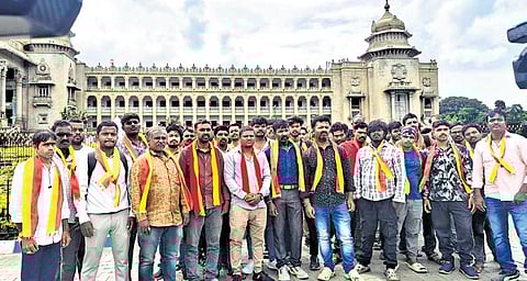 Bike taxi riders hold a protest in front of Vidhana Soudha in Bengaluru