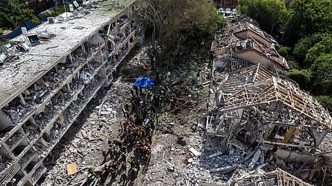 Israeli security forces and first responders gather at the site of an Iranian strike that hit a residential neighbourhood in the Ramat Aviv area in Tel Aviv on June 22, 2025