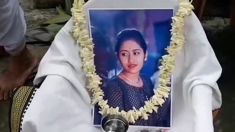 A garlanded photo of the woman was placed at the ceremony conducted by a priest.