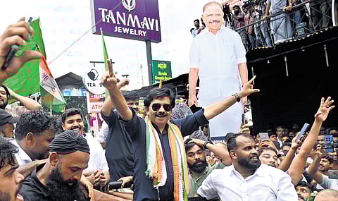 Aryadan Shoukath with jubilant party workers who gathered in Nilambur town after his victory in the by-election on Monday.  