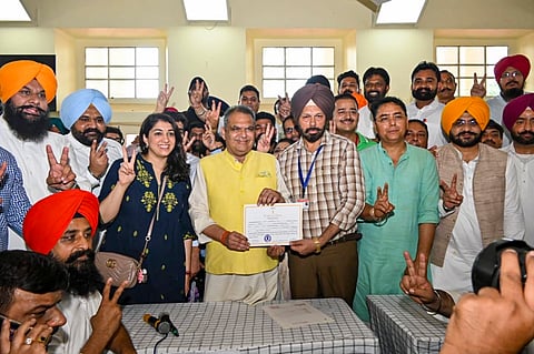 AAP leader Sanjeev Arora receives his victory certificate after winning the Ludhiana West bypoll (Photo | PTI)