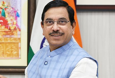 Union minister Pralhad Joshi on Sunday said DCM DK Shivakumar is straddling two boats on the Dharmasthala issue.