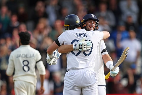England's Joe Root, right, and batting partner Jamie Smith celebrate after their win on day five of the first cricket test match against India at Headingley in Leeds, England, Tuesday, June 24, 2025. 