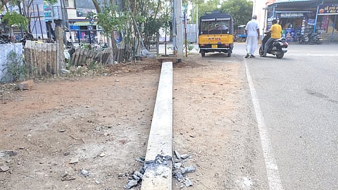 A 55-year-old autorickshaw driver sustained injuries after a recently-installed electric pole dislodged and collapsed on his vehicle.