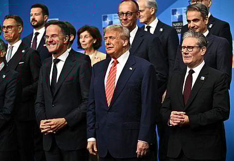 NATO Secretary General Mark Rutte, from left, President Donald Trump and Britain's Prime Minister Keir Starmer pose with NATO country leaders for a family photo during the NATO summit in The Hague, Netherlands, Wednesday, June 25, 2025. 