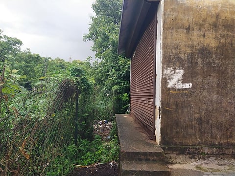 Residents allege that the fence blocks the entrance to a small auditorium built 10 years ago for public use.