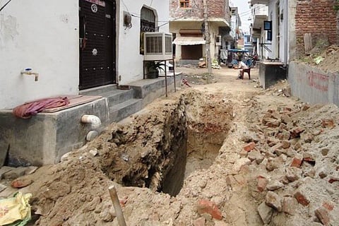 The 10-foot-deep pit in Faridabad from where the victim's body was exhumed by police on June 21.