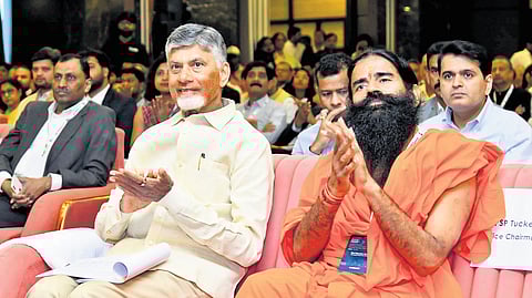 Chief Minister Chandrababu Naidu with Yoga Guru Baba Ramdev at Andhra Pradesh Tourism Conclave Tech AI 2.0 in Amaravati on Friday