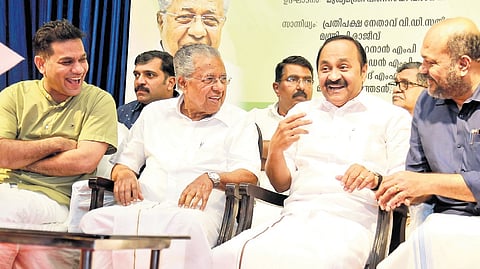 Chief Minister Pinarayi Vijayan in conversation with Leader of Opposition V D Satheesan during the inauguration of Journalist Welfare Fund of the KUWJ in Kochi on Saturday. 
MP Hibi Eden and Industries Minister P Rajeeve are also seen 