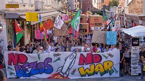 Activists stage a protest in Venice, Italy, Saturday, June 28, 2025, denouncing the three-day celebrations for the wedding between Jeff Bezos and his wife Lauren Sanchez Bezos that took place in Venice on Friday as a symbol of rising inequality and disregard for the city's residents.
