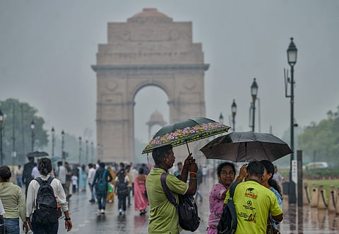 People visit Kartavya Path amid rain, in New Delhi, Sunday, June 29, 2025.