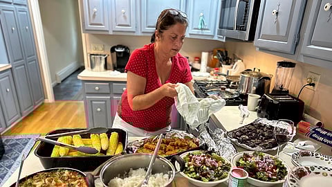In this undated photo provided by her daughter, Mandonna "Donna" Kashanian, 64, prepares a meal.
