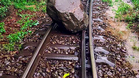A railway track blocked by a boulder following heavy rainfall, at Koti, in Solan district.