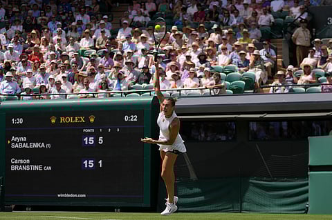 Aryna Sabalenka of Belarus serves the ball to Carson Branstine of Canada during their first round women's single match at the Wimbledon Tennis Championships in London, Monday, June 30, 2025. 