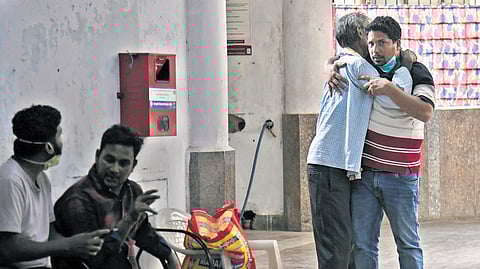 Relatives of workers killed in the accident meet outside the Patancheru Government Hospital mortuary. 