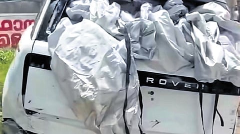 The car that was damaged in the unloading mishap.