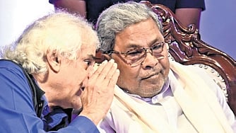 Chief Minister Siddaramaiah speaks to veteran journalist P Sainath during Press Day celebrations in Bengaluru on Tuesday.