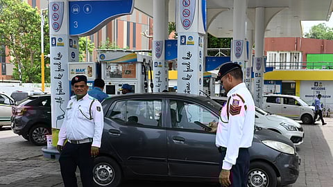 Traffic Police personnel keep a vigil at a petrol pump after fuel ban for end-of-life (EoL) vehicles under the directions of Commission for Air Quality Management (CAQM), in New Delhi on Tuesday