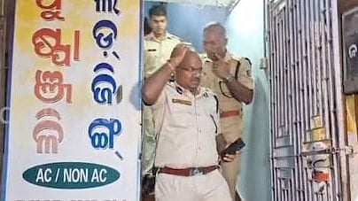 Police at the lodge where the woman was stabbed to death.