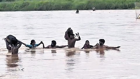 The residents of Kottu crossing the River Nagavali to reach mandal headquarters.