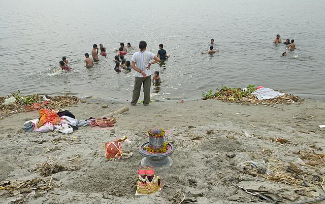 Devotees take a holy dip in the Yamuna River at Jagatpur Ghat 
