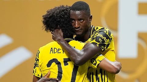Borussia Dortmund's Serhou Guirassy, right, celebrates with teammate Karim Adeyemi after scoring his team's second goal during the Club World Cup round of 16 soccer match between Borussia Dortmund and CF Monterrey in Atlanta, Tuesday, July 1, 2025.