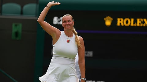 Petra Kvitova of Czech Republic waves to the crowd after her first round women's single match against Emma Navarro of the U.S. at the Wimbledon Tennis Championships in London, Tuesday, July 1, 2025.(