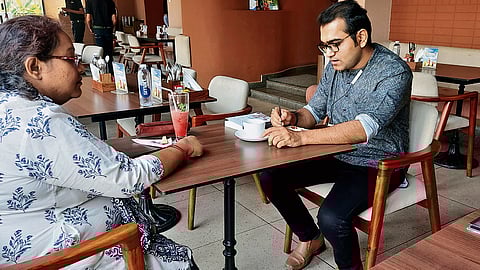 Partha Mukherjee painting in one of the cafes